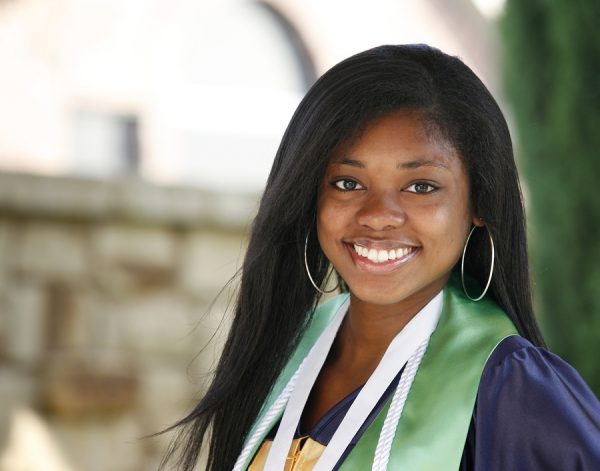 Happy African-American high school graduate  - outside portrait